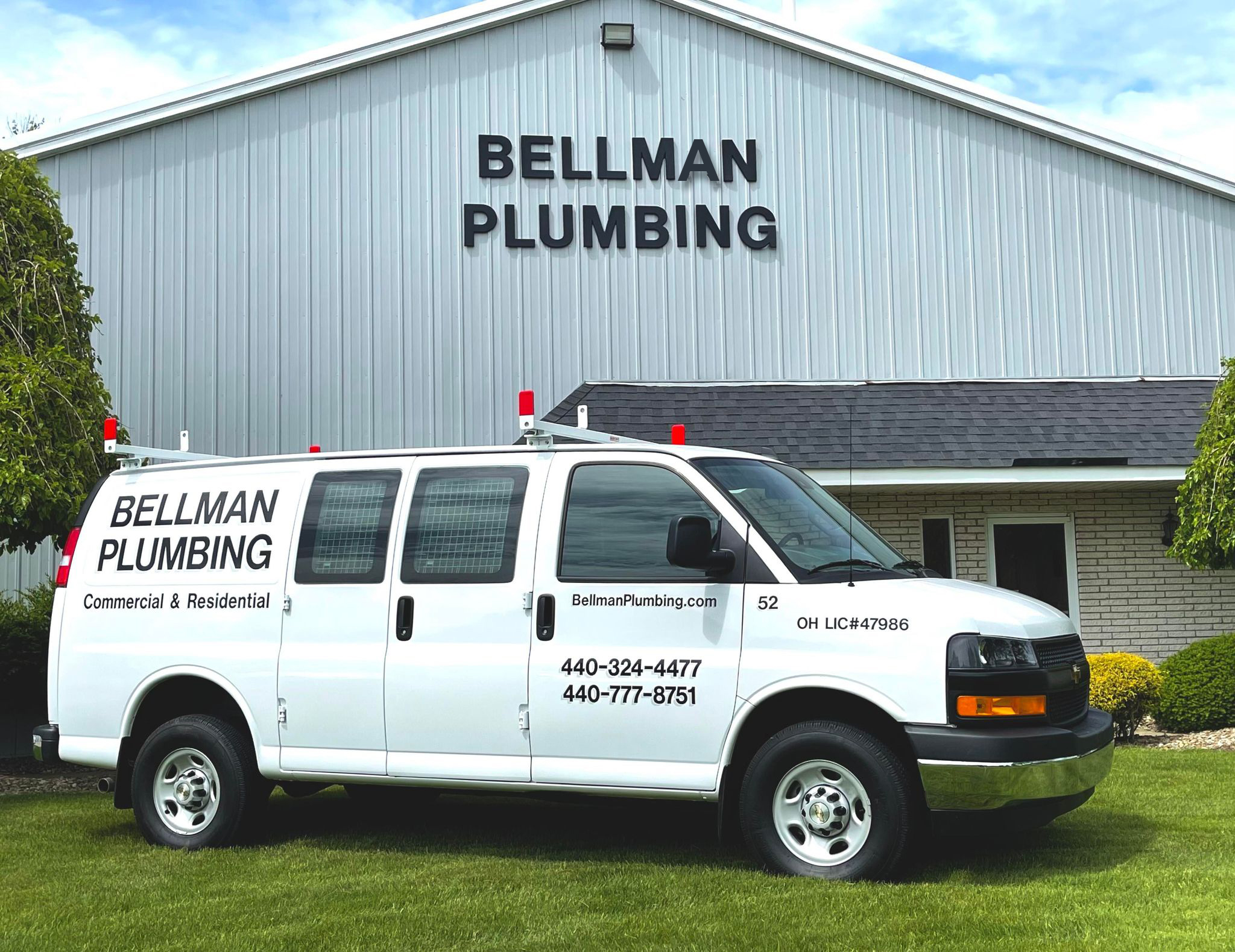 Bellman Plumbing service van parked at job site - Elyria Ohio plumber since 1955